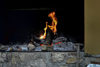 Bonfire on log at night