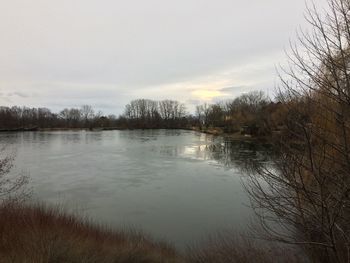 Scenic view of lake against sky during sunset