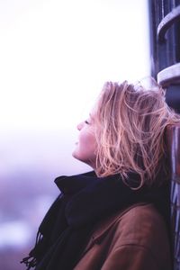 Portrait of a girl looking away in winter