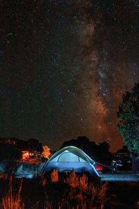 View of illuminated tent against sky at night