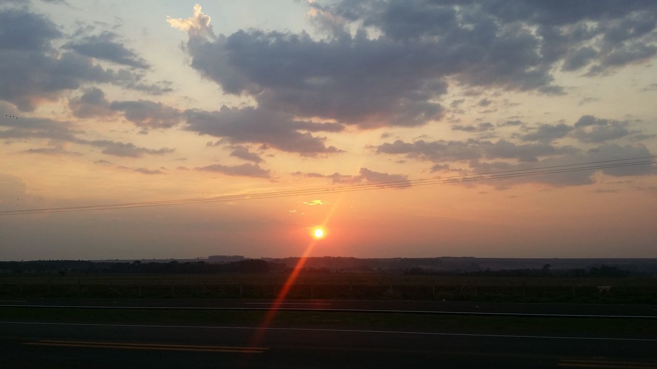 SCENIC VIEW OF SUNSET AGAINST SKY AT DUSK