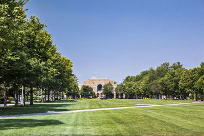 Lawn in university of notre dame against clear sky