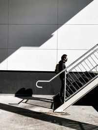 Low angle view of man walking on steps