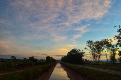 View of railway tracks against sky during sunset