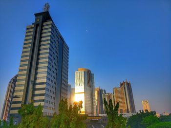 Low angle view of buildings against clear sky