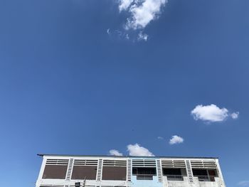 Low angle view of building against blue sky