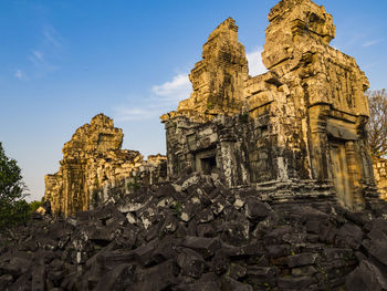 Old temple building against sky