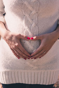 Woman holding heart shape