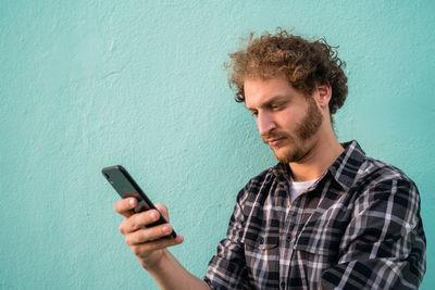 Young man using smart phone