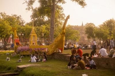 Group of people relaxing in park