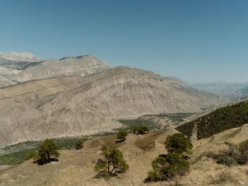 Scenic view of mountains against clear blue sky