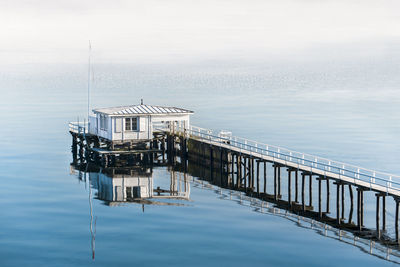 Lifeguard hut on sea against sky in kiel