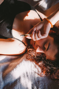 Close-up portrait of woman lying down