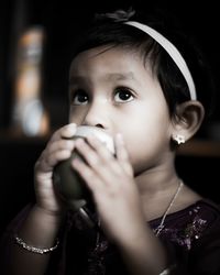 Close-up cute girl drinking water