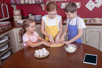 Children playing on table at home