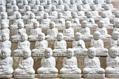 View of buddha statue in row