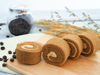 Close-up of breads and beans on table