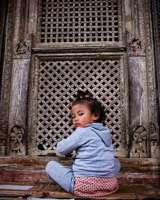 childhood, elementary age, casual clothing, person, lifestyles, boys, innocence, looking at camera, front view, cute, portrait, girls, leisure activity, architecture, standing, full length, built structure, sitting