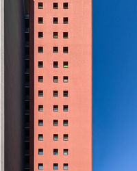 Low angle view of building against clear blue sky