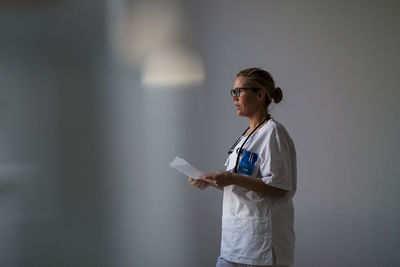 Female doctor looking away