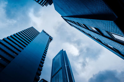 Low angle view of modern buildings against sky