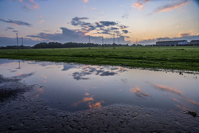 Scenic view of land against sky during sunset