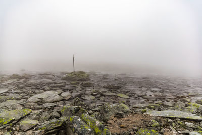Scenic view of landscape against sky during winter