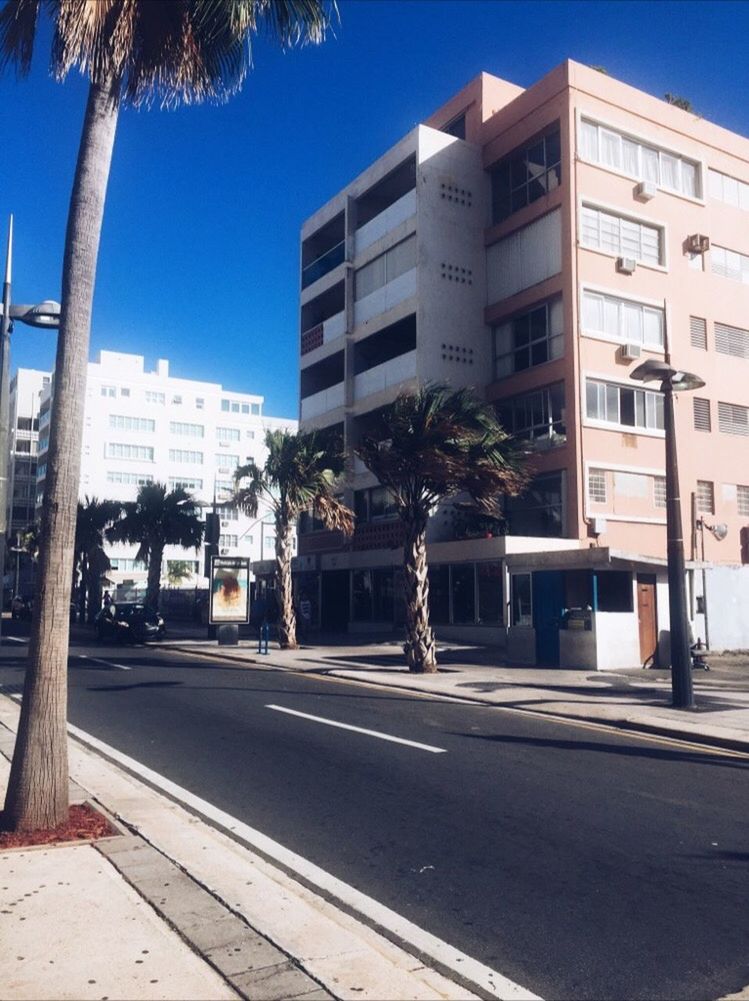 VIEW OF CITY STREET AGAINST SKY