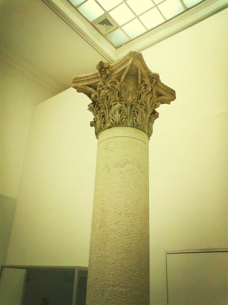 architecture, built structure, indoors, low angle view, architectural column, statue, ceiling, human representation, art and craft, art, famous place, sculpture, architectural feature, column, history, no people, travel destinations, creativity, wall - building feature