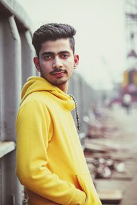 Portrait of young man standing outdoors