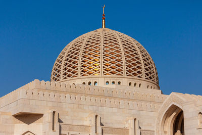 Low angle view of historical building against blue sky