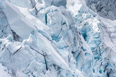 Scenic view of snow covered mountains