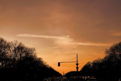 Low angle view of silhouette trees against sky during sunset