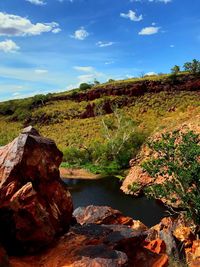 Rock formations on landscape against sky