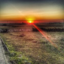 Scenic view of landscape against sky during sunset