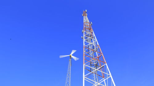 Low angle view of tower against clear blue sky