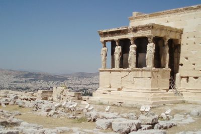 Old ruin parthenon temple against sky