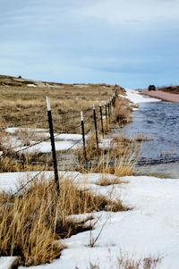 Scenic view of landscape against sky during winter