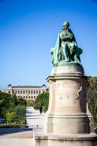 Statue of building against blue sky