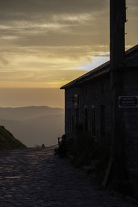 Surface level of pathway against scenic sky