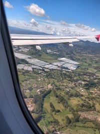 Aerial view of landscape seen through airplane window