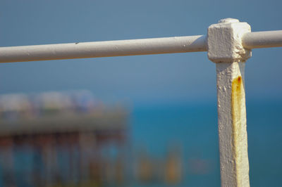 Close-up of cross against blue sky