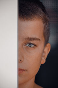 Close-up portrait of young man looking away