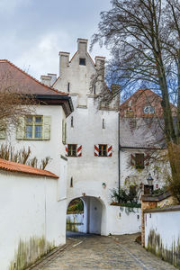 Exterior of old building in town against sky