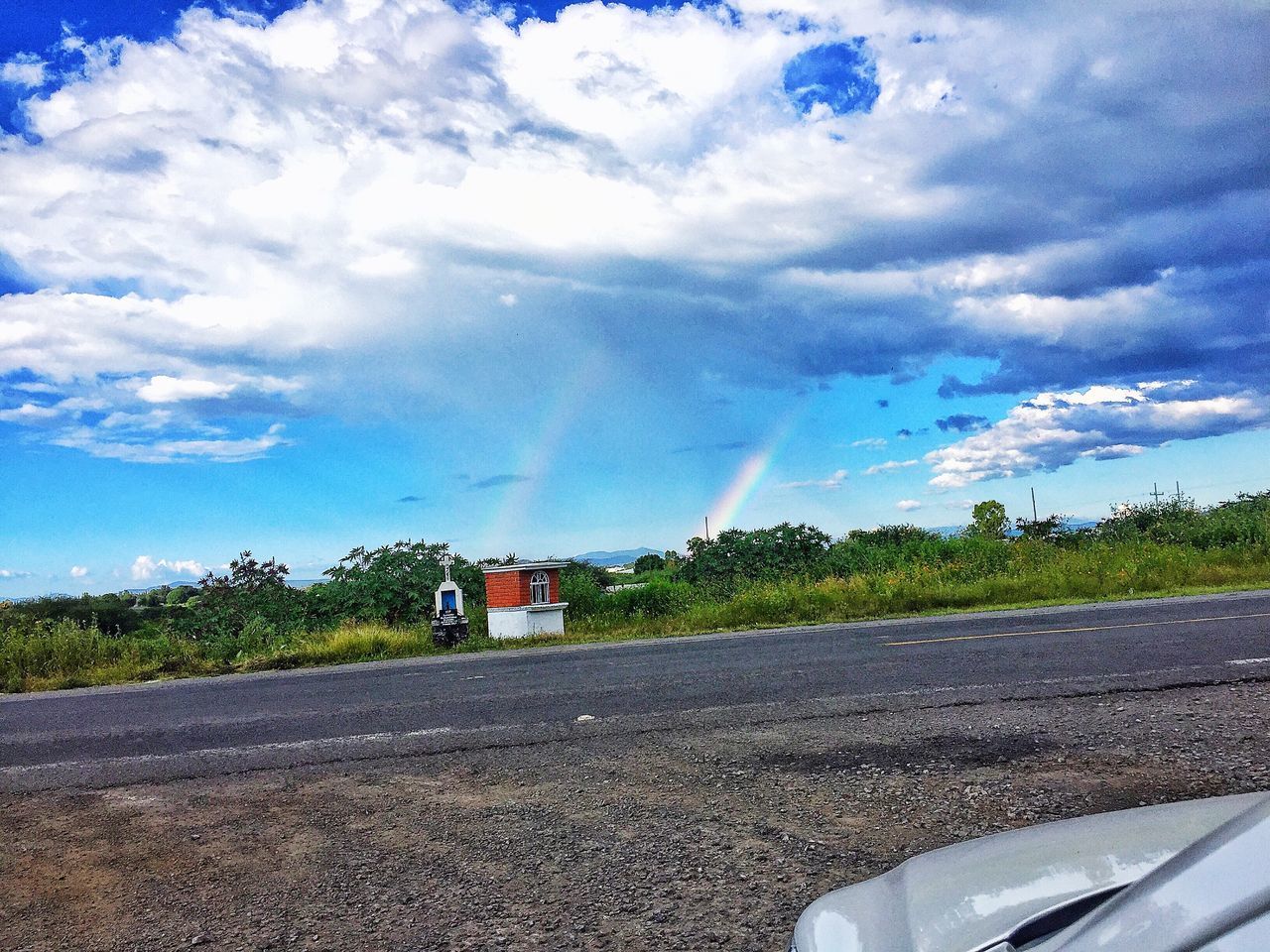 sky, cloud - sky, transportation, road, land vehicle, car, mode of transport, day, no people, outdoors, landscape, nature, tree