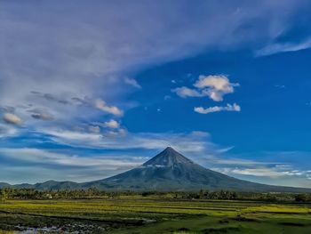 Scenic view of landscape against cloudy sky