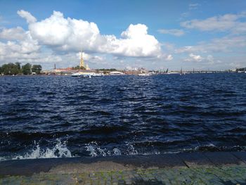 Scenic view of sea against cloudy sky