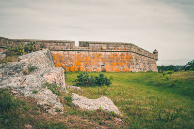 Low angle view of old ruin building against sky