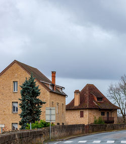 Low angle view of house and building against sky