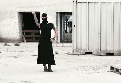 Full length of woman standing in building